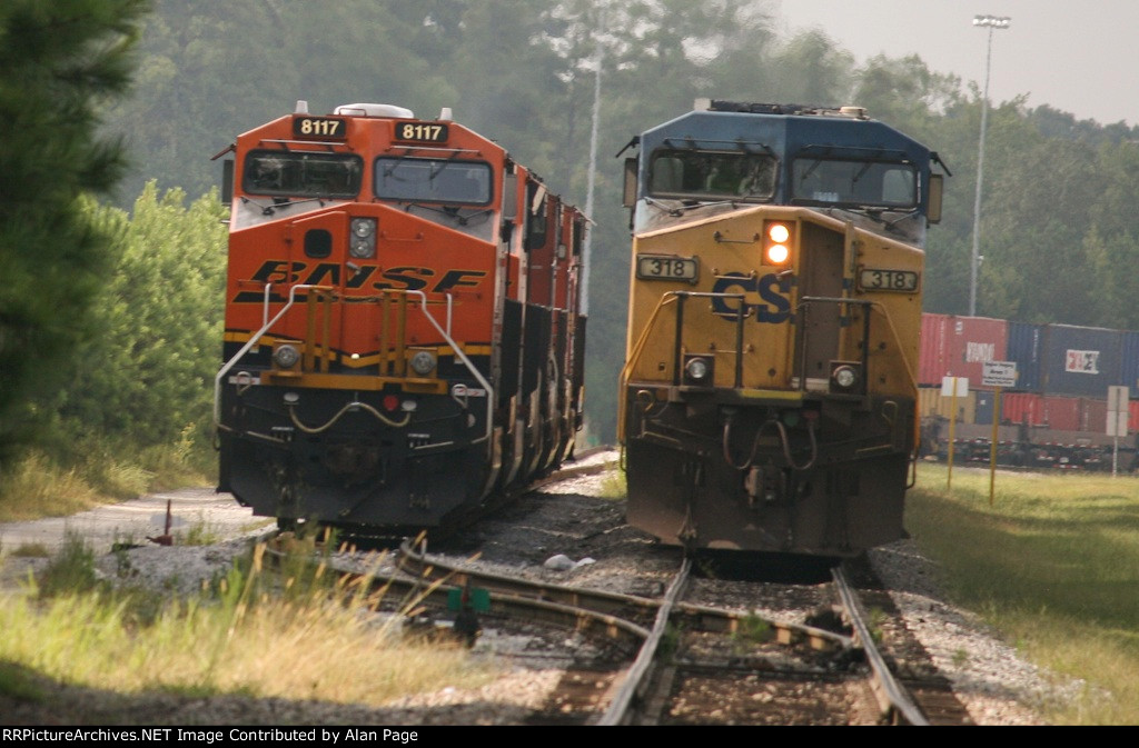 CSX 318 and BNSF 8117 are side by side